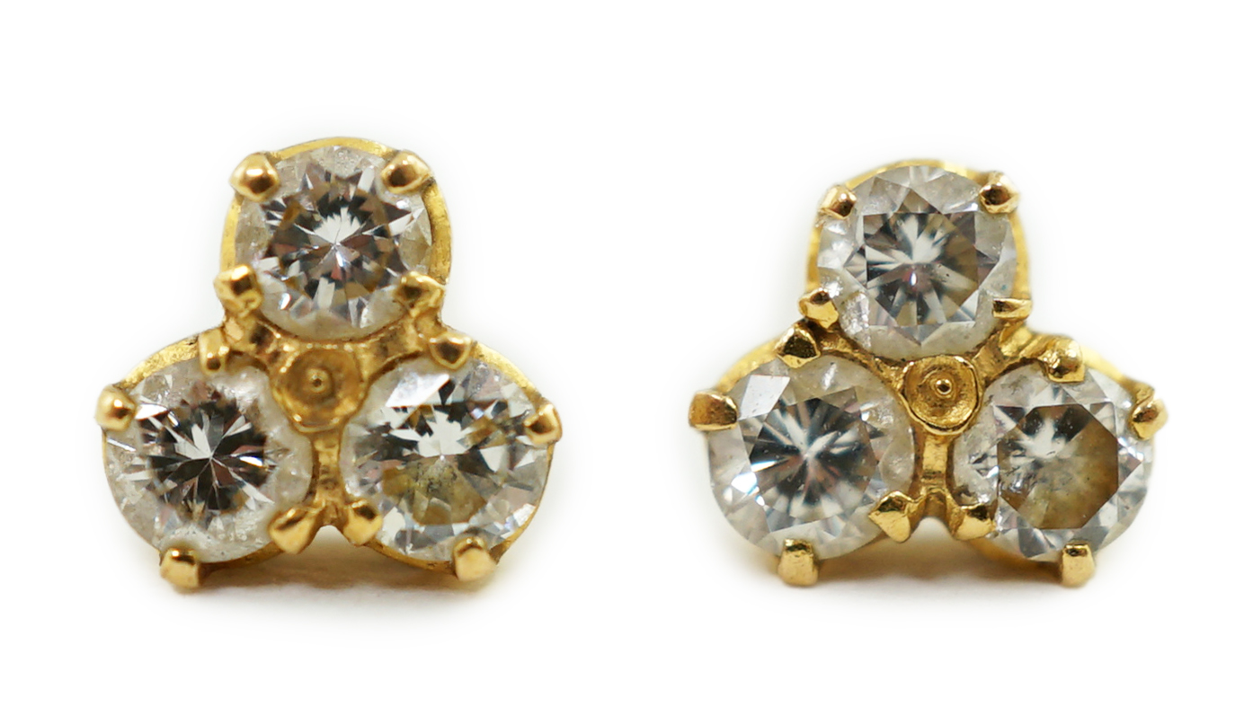 A pair of yellow metal and diamond ear studs